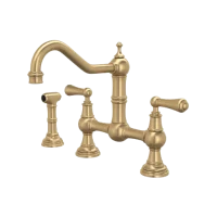 Vintage brass bridge kitchen faucet with cross handles.